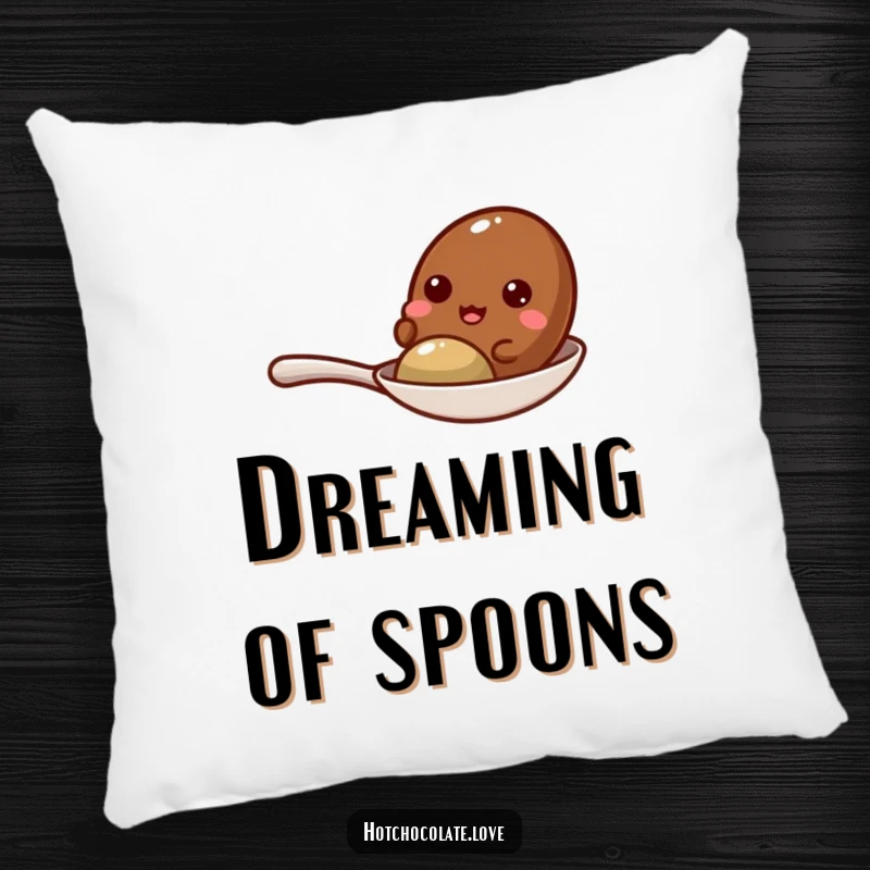 Funny cocoa bean giggling on a tiny spoon, presented on a soft and cozy decorative pillow.
