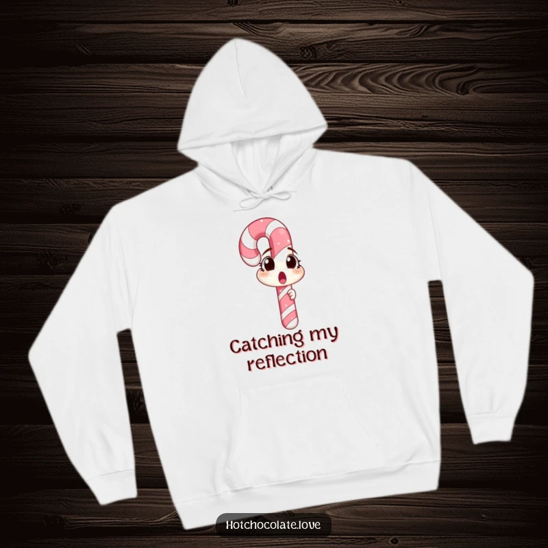A surprised candy cane looking into a mirror, showcased on a cozy hoodie, embodying festive and humorous holiday spirit.