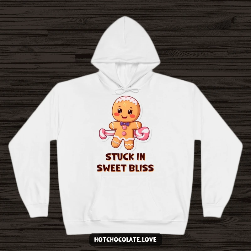 Funny gingerbread man on a peppermint stick design on a cozy hoodie, radiating holiday cheer and humor.