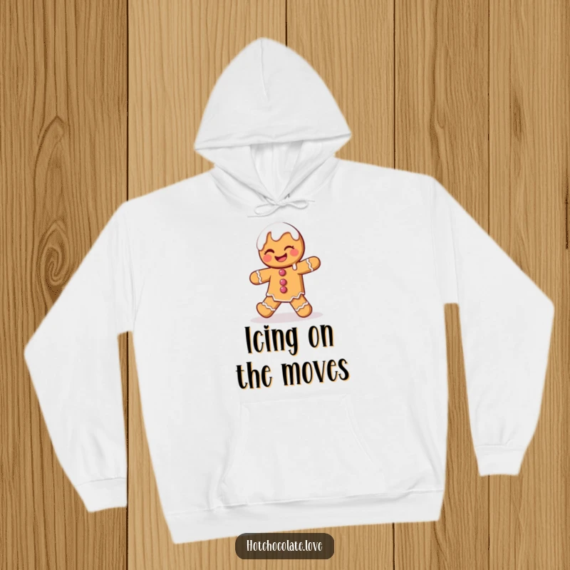 Funny Gingerbread Man Hoodie depicting a winking character performing a playful dance with charmingly dripping icing, perfect for warmth.