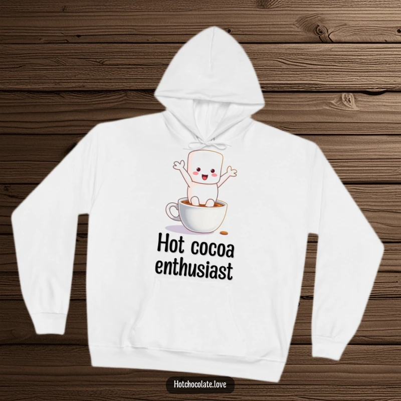 Funny hoodie featuring a delighted marshmallow character mid-leap into a steaming cup of hot chocolate, designed for ultimate cozy humor.