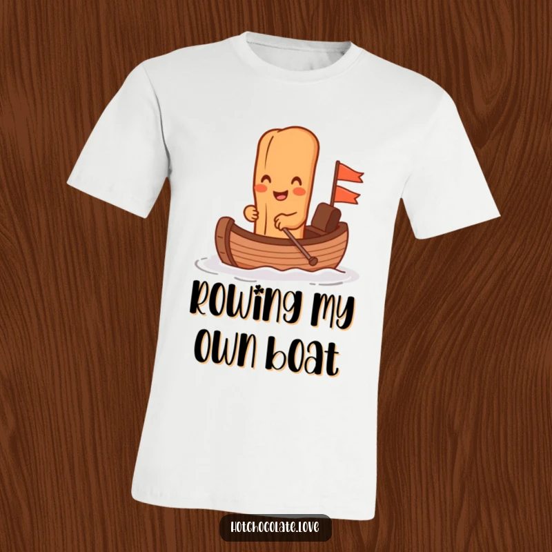 Funny anthropomorphic cinnamon stick enthusiastically rowing a small chocolate boat, depicted on a t-shirt for ultimate comfort and humor.